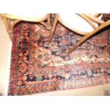 A fine North West Persian nahawand carpet 260cm x 160cm, central floral pendant medallion with