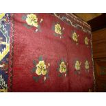 A fine handwoven Persian Shiraz Quasgai rug scarlet field with repeating gol farong motifs