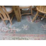 A French Aubusson rug the biscuit fields with allover foliate decoration