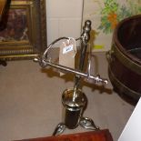 A chrome toilet roll and brush holder  H 68 cm