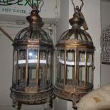 A pair of domed glass hanging lanterns