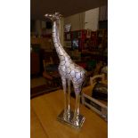 A silvered floor standing giraffe, H 36