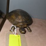 A bronzed tortoise bell