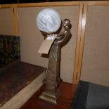 An Art Deco style table with Lady holding opaque shade and a lamp