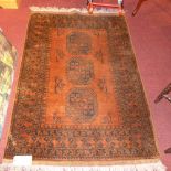 An Afghan hand knotted rug, the mustard ground with gold motifs and a smaller similar.