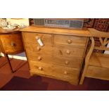 A Victorian pine chest fitted two short and three long drawers with knob handles