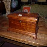 A C19th mahogany sarcophagus form box, inlaid inside the lid, with a secret drawer to the rear