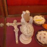 A collection of reconstituted marble items including a crucifix, a bust of Eros, a statuette and