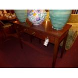 A C19th mahogany writing table fitted two drawers and raised on square tapering supports