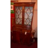 A C19th mahogany library bookcase fitted pair of astragal glazed panel doors above pair of drawers