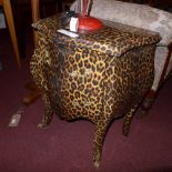 A French style two drawer commode chest with leopard print finish and gilt metal handles