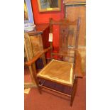 An Arts and Crafts oak open armchair the pierced back above pad seat, Edwardian cakestand and