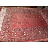 A hand knotted Bokhara rug the rose fields with geometric decoration