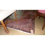 A hand knotted Bijour rug the red fields with allover foliate decoration in a cream flowerhead