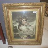 A Victorian mezzo tint portrait of a girl wearing a garland of flowers in a gilt frame