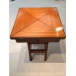 A Waring and Gillow games table of envelope form,