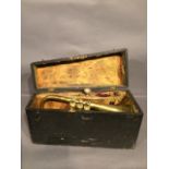 A late 19th cent cased brass bugle in wooden case,
