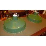 A pair of green painted metal hanging lights