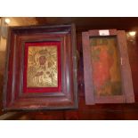 An icon depicting an angelic figure in a rustic wooden frame together with another icon depicting