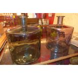 A near pair of oversized glass jars