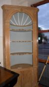 A large pine floor standing corner cabinet, with painted recess incorporating three shelves over two