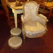 A French giltwood fauteil together with two footstools upholstered in matching ivory fabric