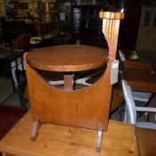 An Arts and Crafts style oak adjustable smokers companion table