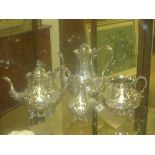 SOLD IN TIMED AUCTION
A silver plated item four piece teaset with profuse foliate decoration