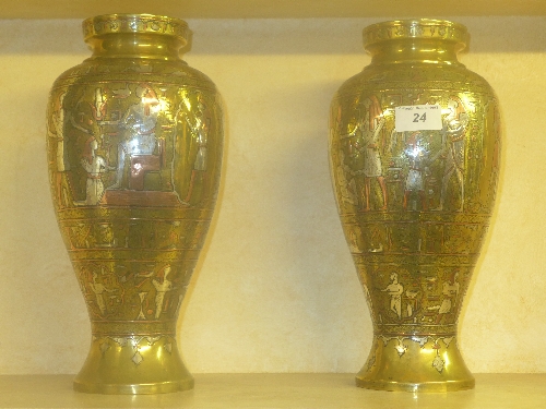 A pair of Cairo ware bulbous form case with mixed metal relief decoration