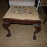 A Chippendale revival mahogany stool with needlework seat on ball and chain feet
