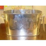 A silver plated 2 wine cooler with coat of arms on sides