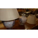 A pair of Chinese style lamps with dragon detail and matching shades