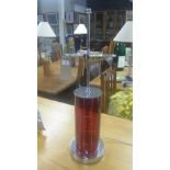 A pair of retro design chrome twin light table lamps fitted cylindrical red glass columns