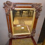 A leather bound floral mirror early C20th