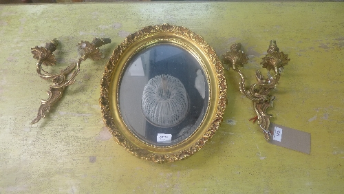 A pair of twin branch brass wall sconces with lustres and a gilt mirror