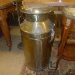 A large brass milk churn