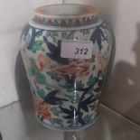 An antique Chinese jar decorated with fo