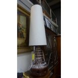 A 1960s brown and white glazed table lamp with matching shade