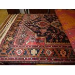 A fine North West Persian Hamadan rug, central pole medallion with repeating petal motifs on a