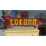 A wrought iron painted Corona sign