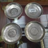 A set of four silvered metal Chinese style coin dishes