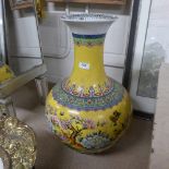 A large Chinese style yellow glazed vase with floral decoration H56