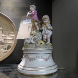 A Meissen style figure group of children on floral wreath stand H32