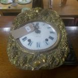 A French white enamel and gilt metal clock