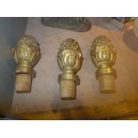 A set of six carved wooden gilt cone form finials