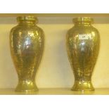 A pair of Cairo ware bulbous form vases with mixed metal relief decoration