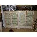 An early 20th Century white painted bookcases with four Daniel drawers on bracket feet (H166 x