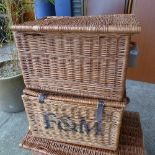 A pair of Fortnum and Mason wicker hampers.