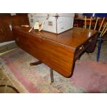 A mahogany sofa table with two drawers one faux raised on quadruped supports