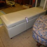 A contemporary cream leather Ottoman (38 x 122 x 46)